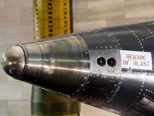 Two circlular indentations on side of rounded nose of black titanium North American x-15 aircraft