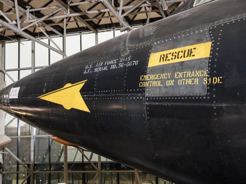 Yellow rescue label and yellow spear detail on nose of black titanium North American x-15 aircraft