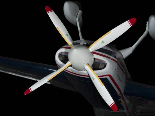 Four-blade propeller of Extra 260 aircraft hanging inverted