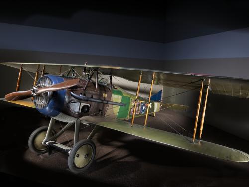 Green and brown Spad XIII "Smith IV" biplane in museum