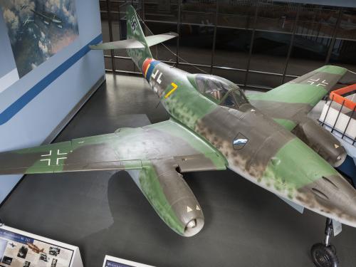 Top view of a green and gray camouflage fighter military monoplane with two engines. Monoplane is on display in the Museum.