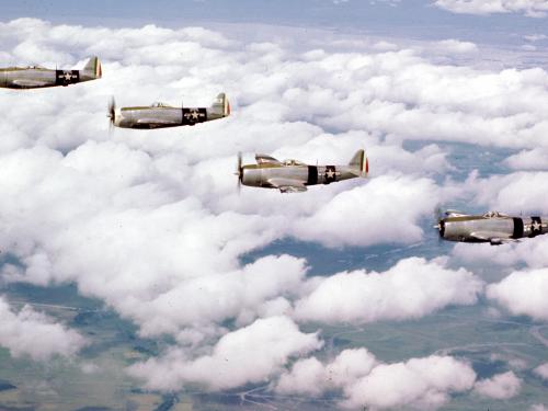 A flight of Mexican 201 Squadron P-47 Thunderbolts over Luzon