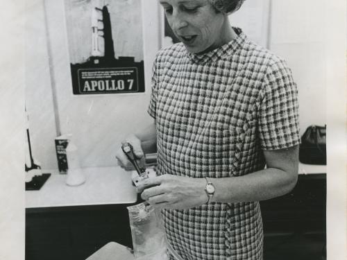 Rita Rapp carefully stows a bag of frankfurters besides labeled meal packages.