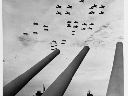 Carrier airplanes seen over the USS Missouri’s guns