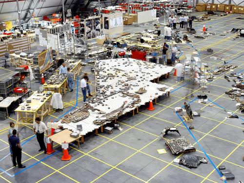 In Kennedy Space Center’s Reusable Launch Vehicle hangar, investigators placed recovered fragments of the underside of Columbia’s left wing onto a table that showed their relative position on the wing. 