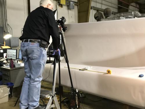 Volunteer Jim Walker takes a high-resolution photograph of a Langley artifact.