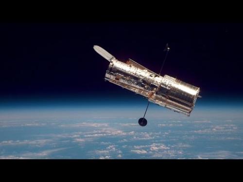 An interview with a Smithsonian curator about the repairs on the Hubble Space Telescope performed by astronauts soon after the launch of the telescope