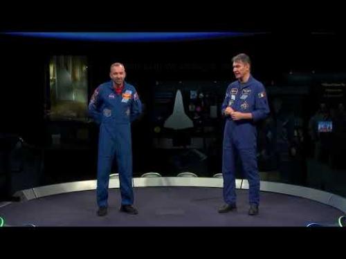 A question and answer session with students asking questions to two astronauts who have recently returned from a space mission.