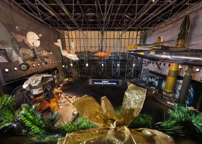 Image of the Museum's entry gallery from the second floor. A rainbow can be seen outside. 