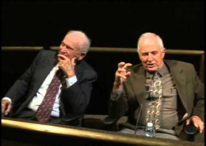 A lecture panel with the three astronauts in the Apollo 8 mission.