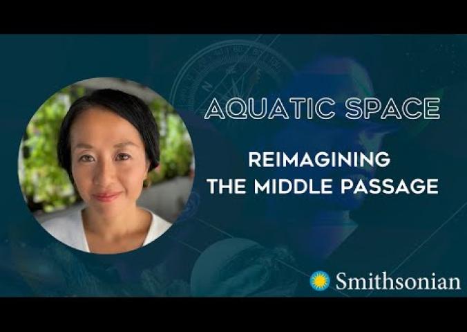 A woman speaks into the camera, presenting on the Afrofuturism concept of aquatic space.