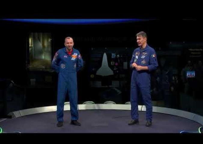 A question and answer session with students asking questions to two astronauts who have recently returned from a space mission.