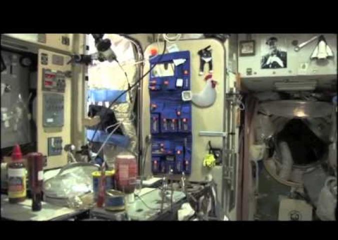  Garrett Reisman shows the Russian module where astronauts sleep.