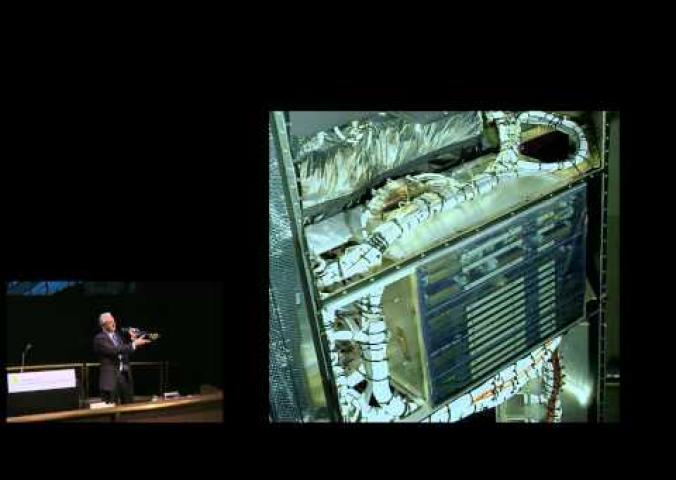 A lecture from a former NASA astronaut discussing the final Hubble Space Telescope repair mission.