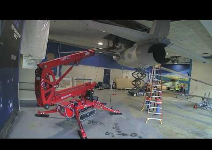 Timelapse video of an aircraft being lowered from ceiling