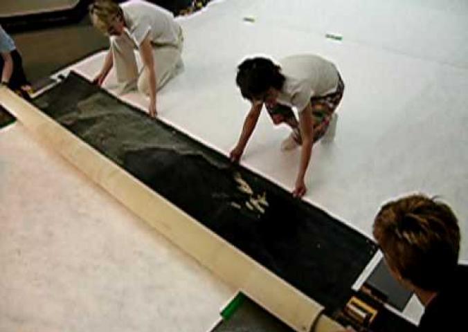 A video of conservationists at the Air and Space Museum unrolling and inspecting the Bonestell Mural.