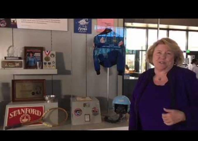Interview with curator in front of the Sally Ride display case. 