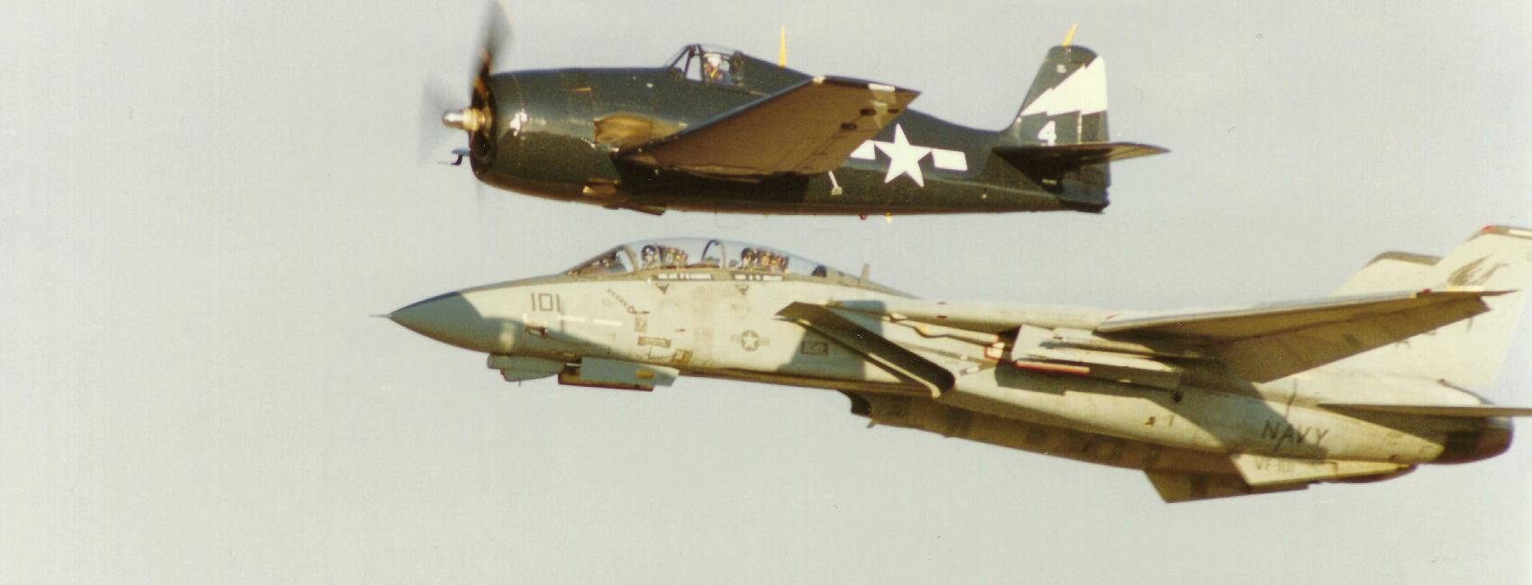  An F-14 Tomcat and F6F Hellcat flying in formation