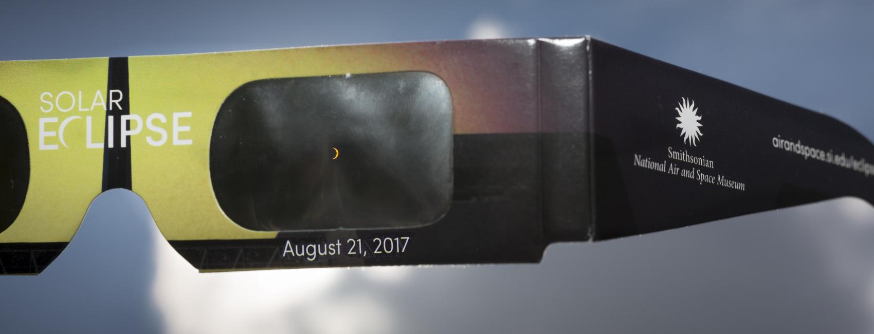 View of a partial eclipse through eclipse viewing glasses