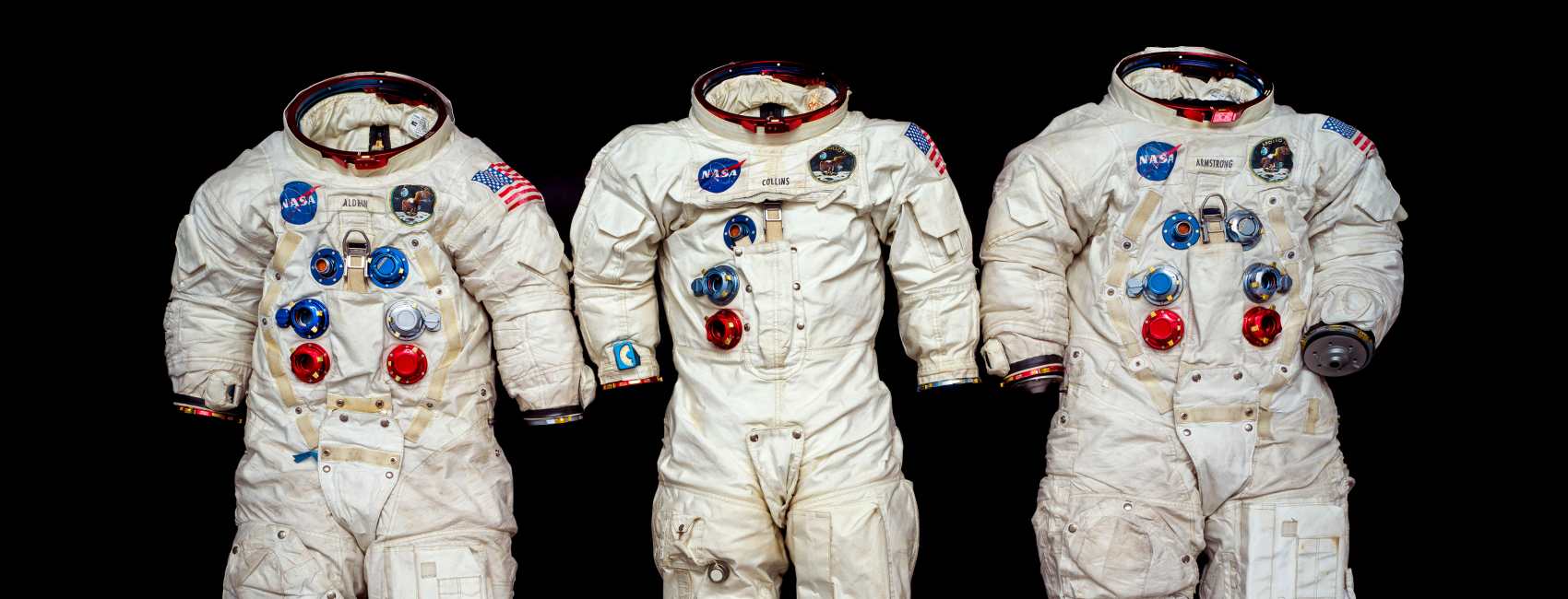 three white Apollo spacesuits