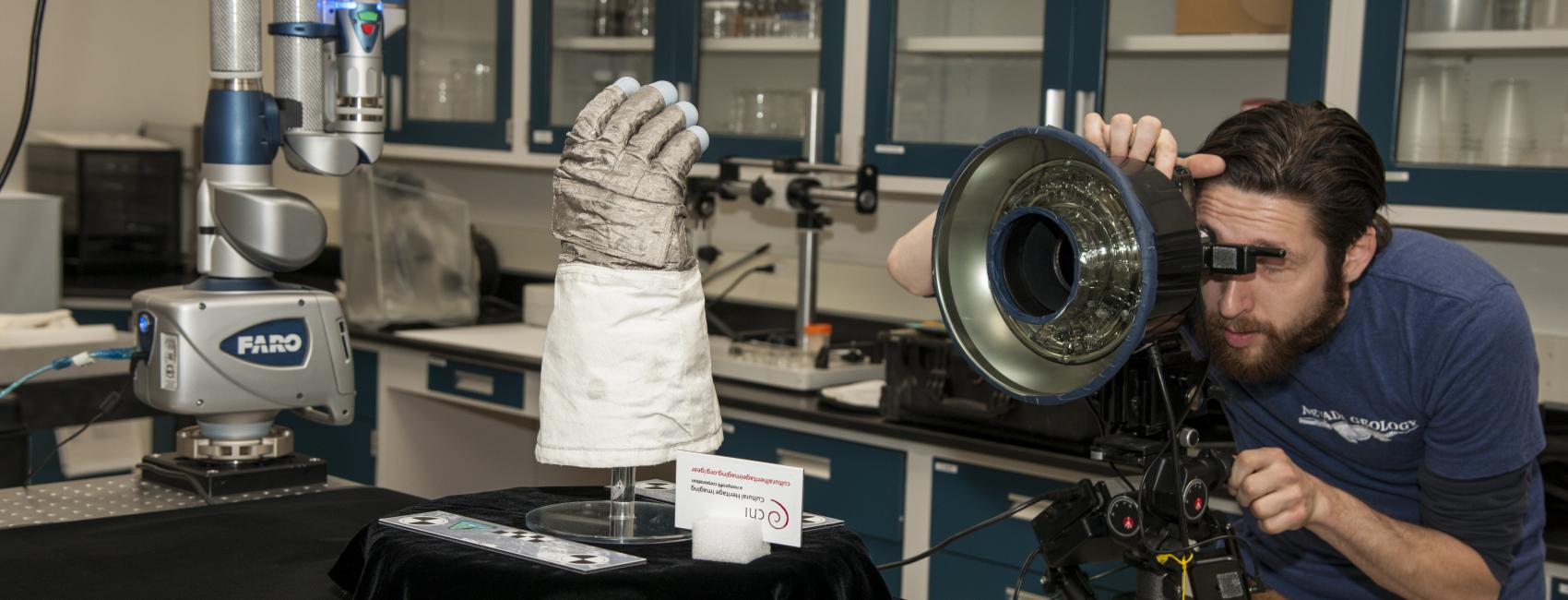 Armstrong glove on a stand while being 3D scanned.