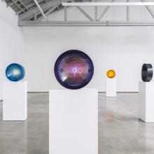 Spherical art in a gallery.