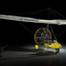  Yellow painted French two-seat flying wing ultralight inside the museum. 