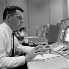 Man sitting at a flight control station