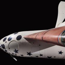 Profile view of SpaceShipOne against black background.