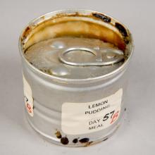 Can of lemon pudding with detaching lid, before treatment           