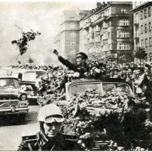 Soviet cosmonaut Yuri Gagarin waves to crowds at parade