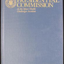 A canvas bound book cover with metallic lettering "Report of the Presidential Commission on the Space Shuttle Challenger Accident."