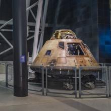 The Space Shuttle Discovery and Apollo 11 command module Columbia are both on display at the Steven F. Udvar-Hazy Center in this photograph.