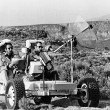 Dave Scott (right) and Jim Irwin (left) driving the Geologic Rover (aka Grover) along the rim of the Rio Grande Gorge at Taos, New Mexico. 