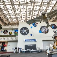 A lunar module and plane are visible in the gallery. 