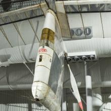 Image of an aircraft hanging in a gallery 