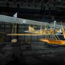 View of the front of a seaplane in a gallery. 