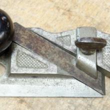 A close-up of a Stanley Model 98 Side Rabbet Plane tool, circa 1910.