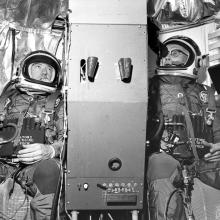 Black and White photo of Joseph W. Kittinger, Jr., and William C. White seated in their positions within the Operation Stargazer gondola.