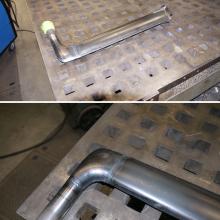 [Top] One radar mast fully welded. [Bottom] Detail view of the elbow welded in place.