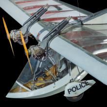 View of cockpit of a twin engine ultralight aircraft. The background of the image is black.