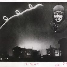 An image of an illuminated curly flight path on the left with a picture of Ruth Law on the right.