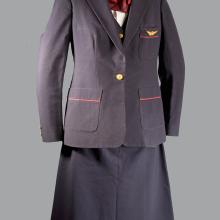 A photo of a dark colored formal uniform on a mannequin. 