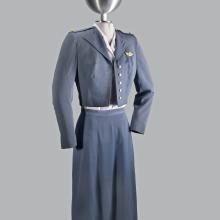 A photograph of a blue-gray uniform on a mannequin. 