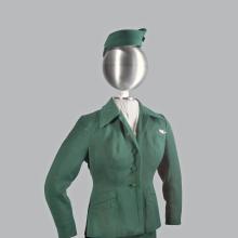 A photograph of a green colored uniform on a mannequin.