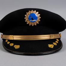 A front few of hat from an airline uniform compared side by side with a bottom view.