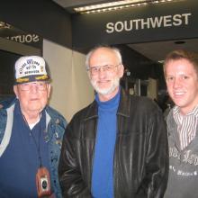 Glenn Lane, Jim Zimbelman and a young man posing for a picture that captures them from the waist up.