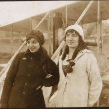 Katherine Stinson (left) and Marjorie C. Stinson (right) posed standing in front of Katherine's Wright Model B, circa 1913 