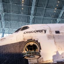 Space Shuttle Discovery with the hatch to the cockpit open.