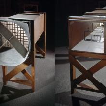 A rectangular shaped wooden wind tunnel seen facing two different directions in a side-by-side comparison.